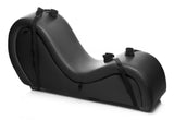 Black chaise lounge leather with pillows and hidden restraints